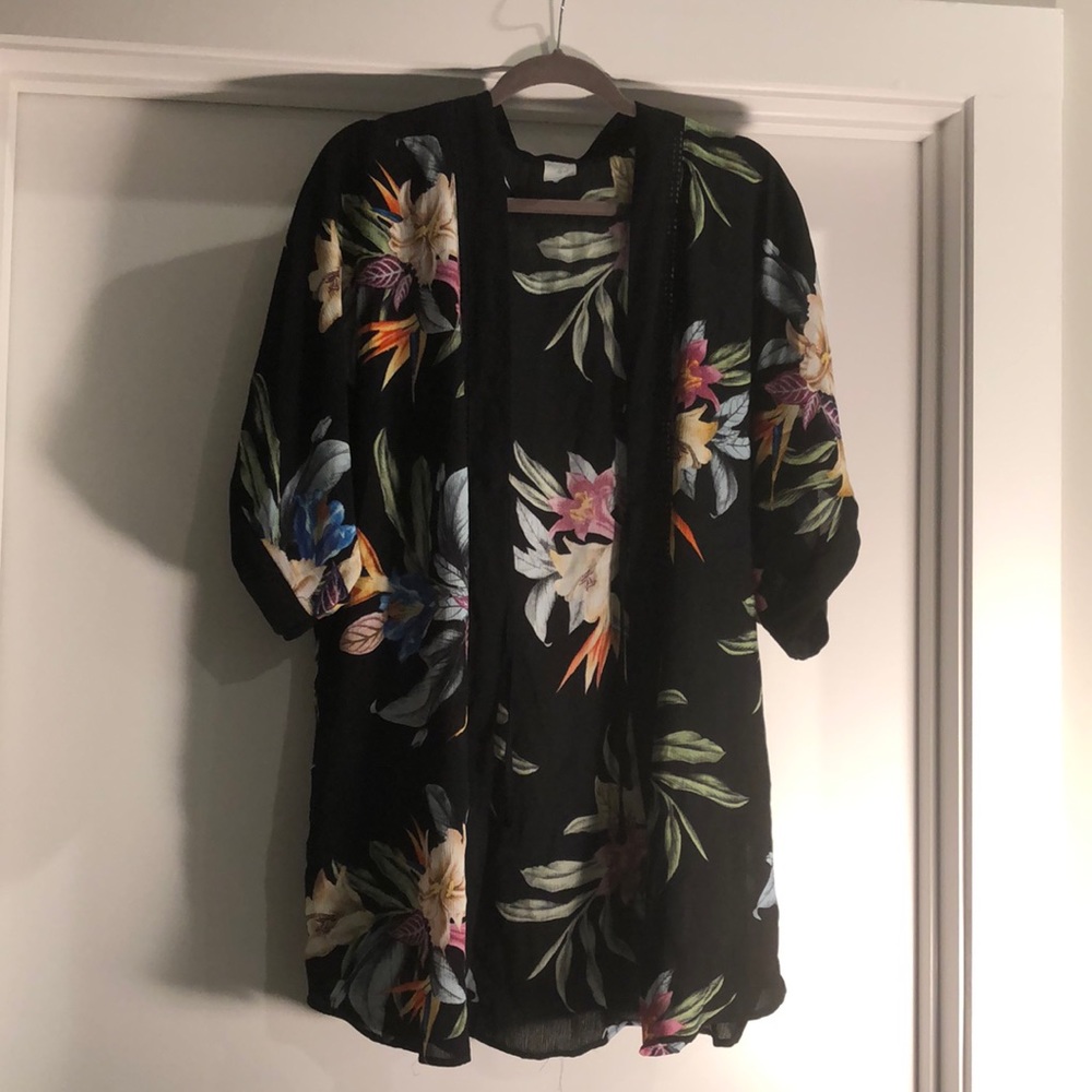 Kimono or could be used as a pool coverup. Tropical print on it.